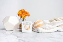 Load image into Gallery viewer, Envy's Comfort CBD Bath Bomb provides an aromatic blend of orange and lemon. With its antibacterial, antiviral, and immuno-stimulant properties, this combination of essential oils is a natural analgesic that helps to detox the body. Every Bath Bomb contai